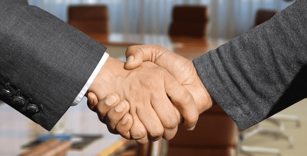 Business people shaking hands on a b2b printing deal