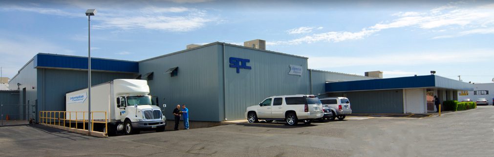 Photo of Information Outsource and SPC Warehouse In Arizona With Company Vehicles Outside
